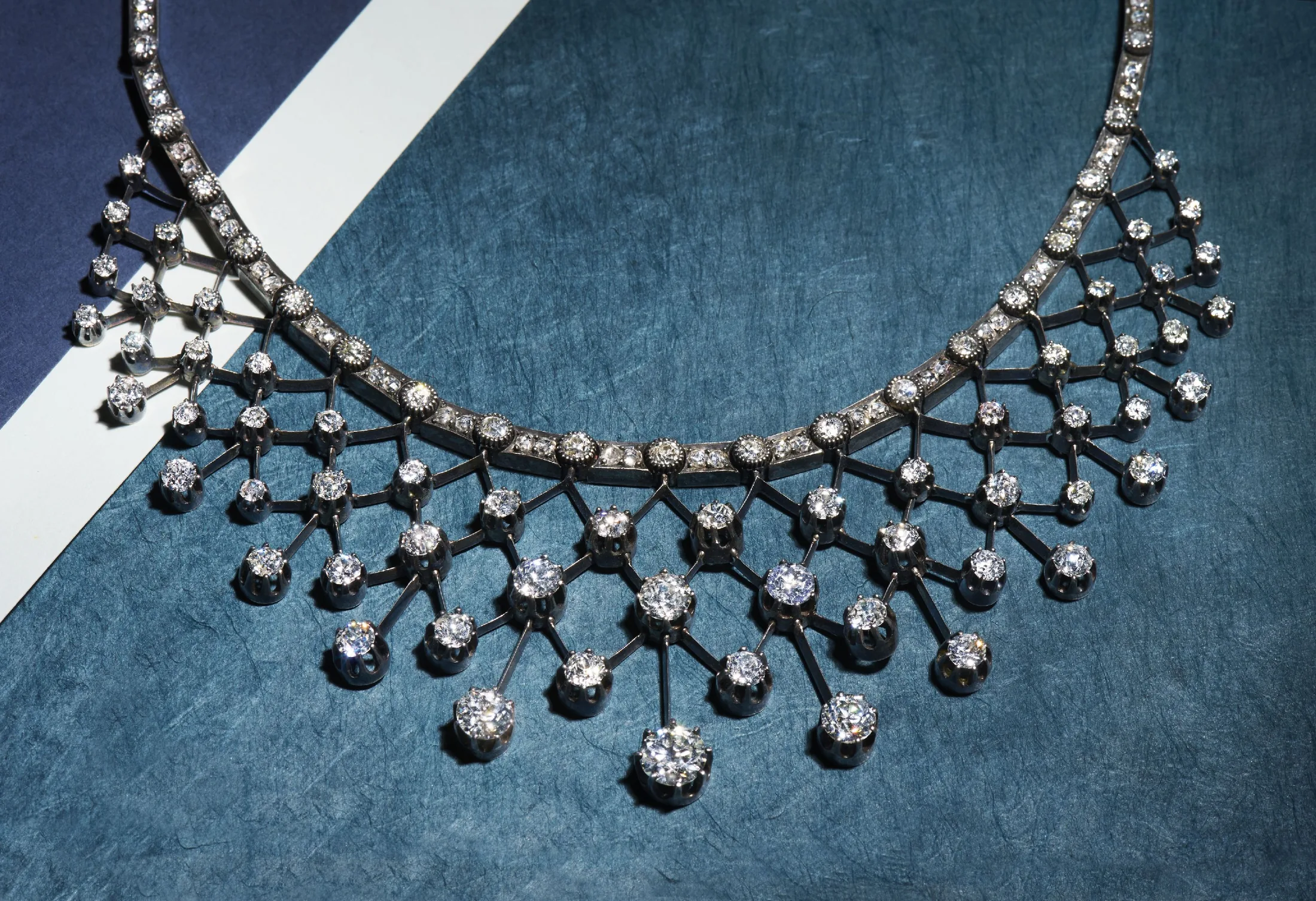 Exceptional Fred Leighton diamond fringe necklace on a deep blue surface